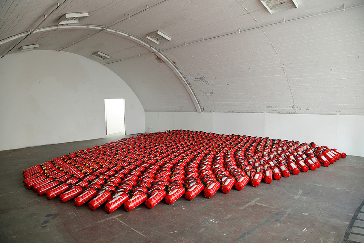 Sound Installation. Fortmation of fire extinguishers. Leaking sound is heard.